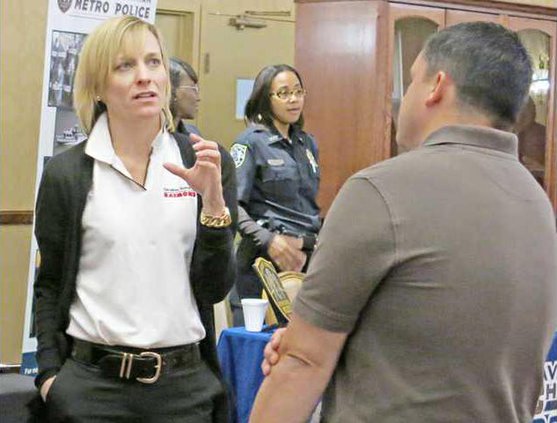 Caolina Handling employees talk to soldier