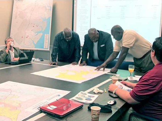 city leaders look at GIS map of proposed Westside annexation area for allocation to council districts